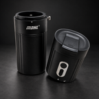 Edited studio image of the Portable Electric Coffee Grinder with its two body sections separated on a charcoal background.