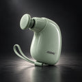 Green Mini Massage Gun on dark studio background