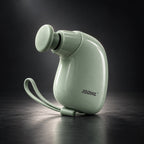 Green Mini Massage Gun on dark studio background