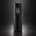 Portable Electric Coffee Grinder on dark studio background